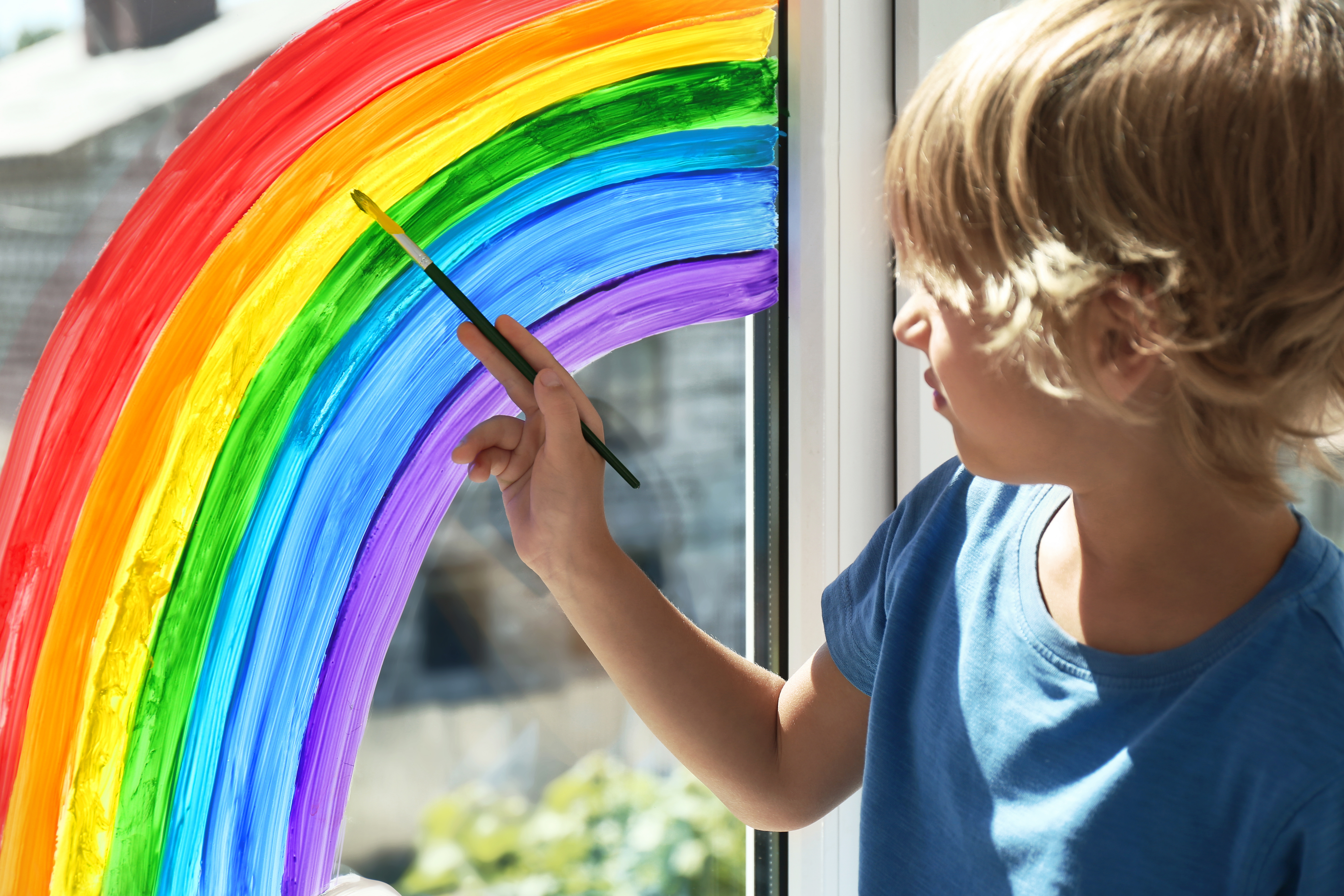 Child Painting a Rainbow