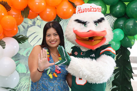 Sebastian the Ibis with DPHS student doing the U sign