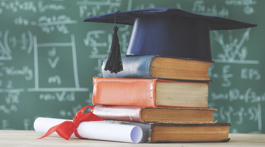 Graduation cap on top of books