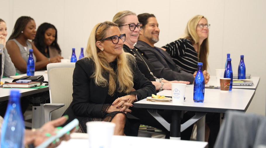 DPHS staff and faculty sitting together and smiling