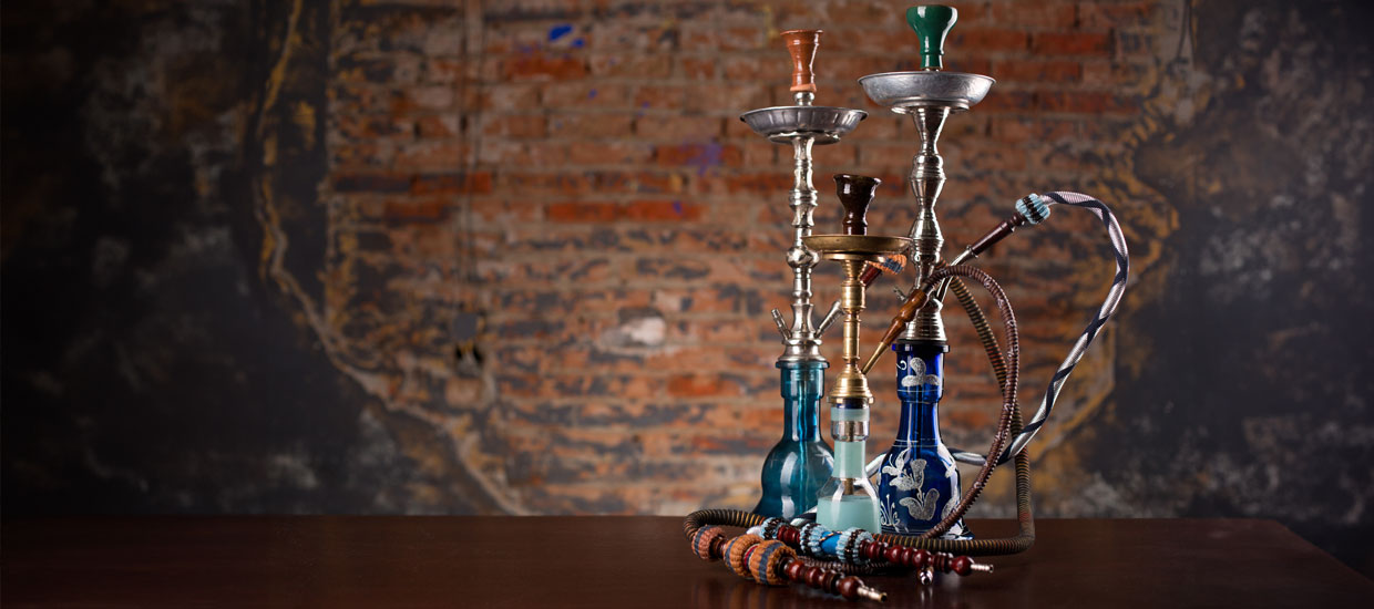 Three hookahs on top of a table