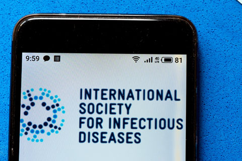 Close-up view of mobile phone screen displaying logo for International Society for Infectious Diseases