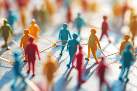 Miniature figures of various colors connected with lines
