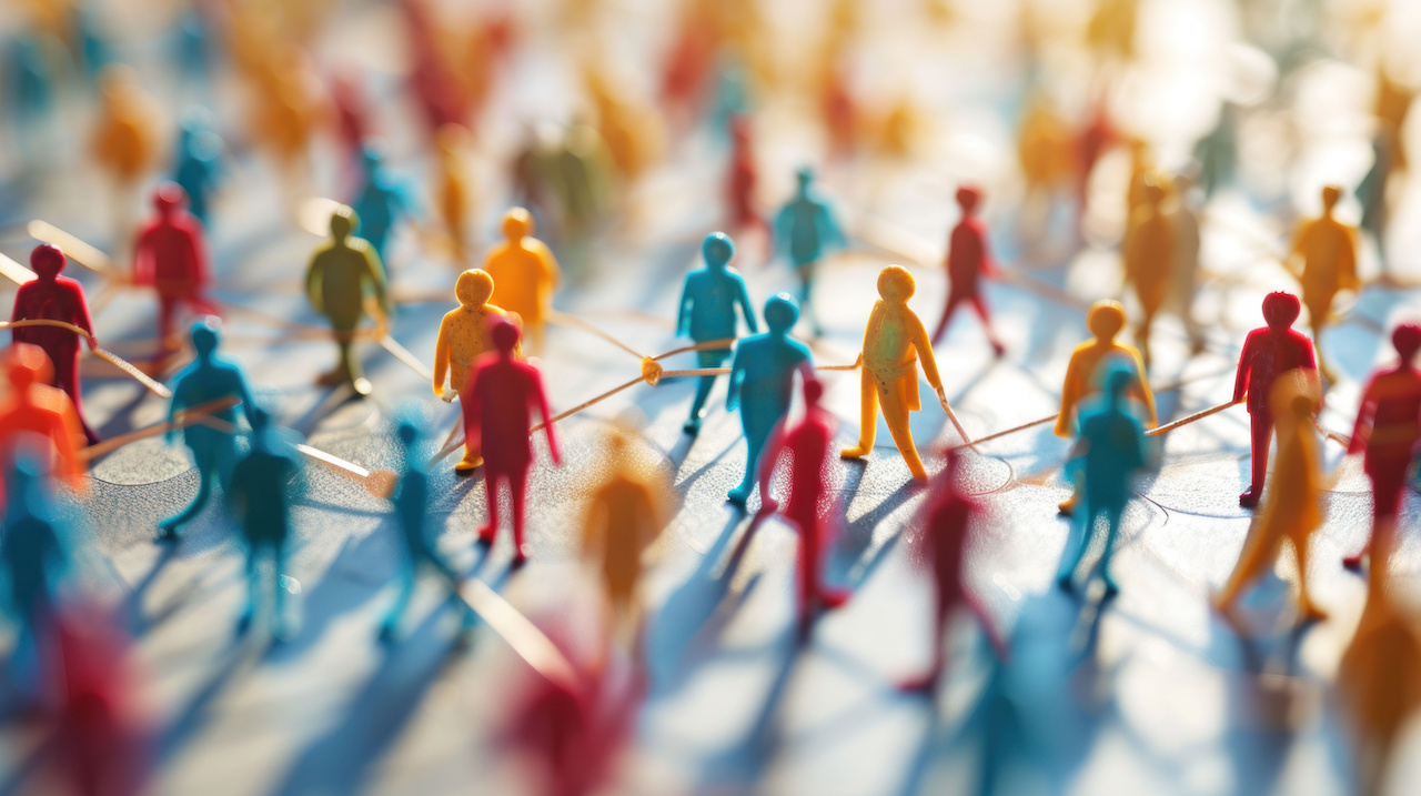 Miniature figures on a network of lines illustrate the interconnectedness of global health and community jpeg