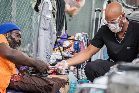 Needle exchange with nurse and a person 