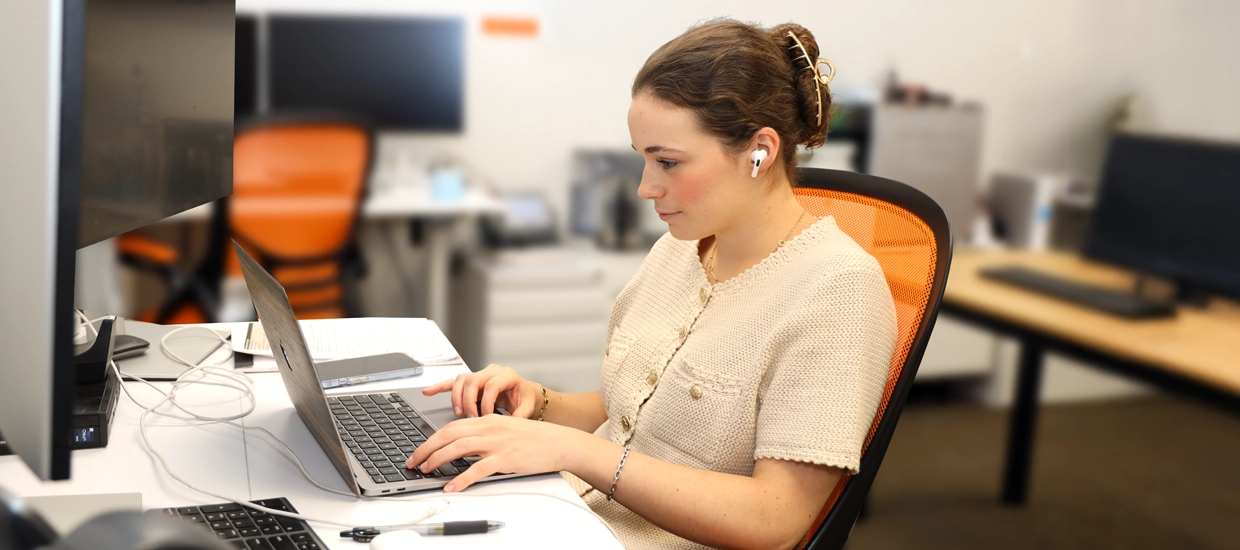 Student on computer conducting research